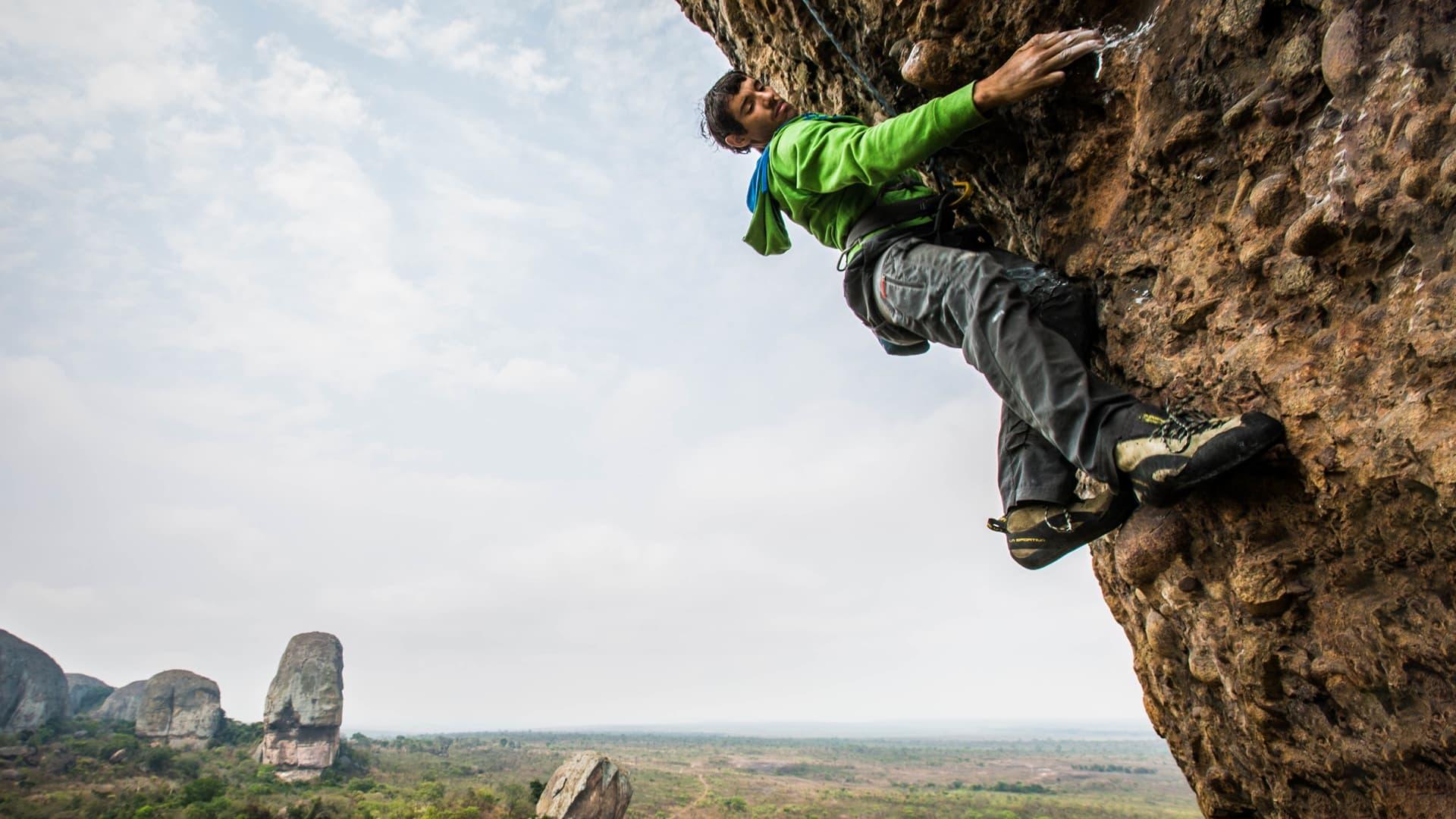 Crack Climbs and Land Mines, Alex Honnold in Angola backdrop