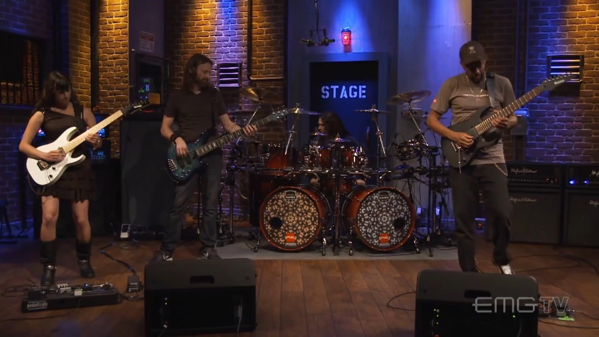 Tony MacAlpine and band perform "Tears of Sahara" on EMGtv backdrop