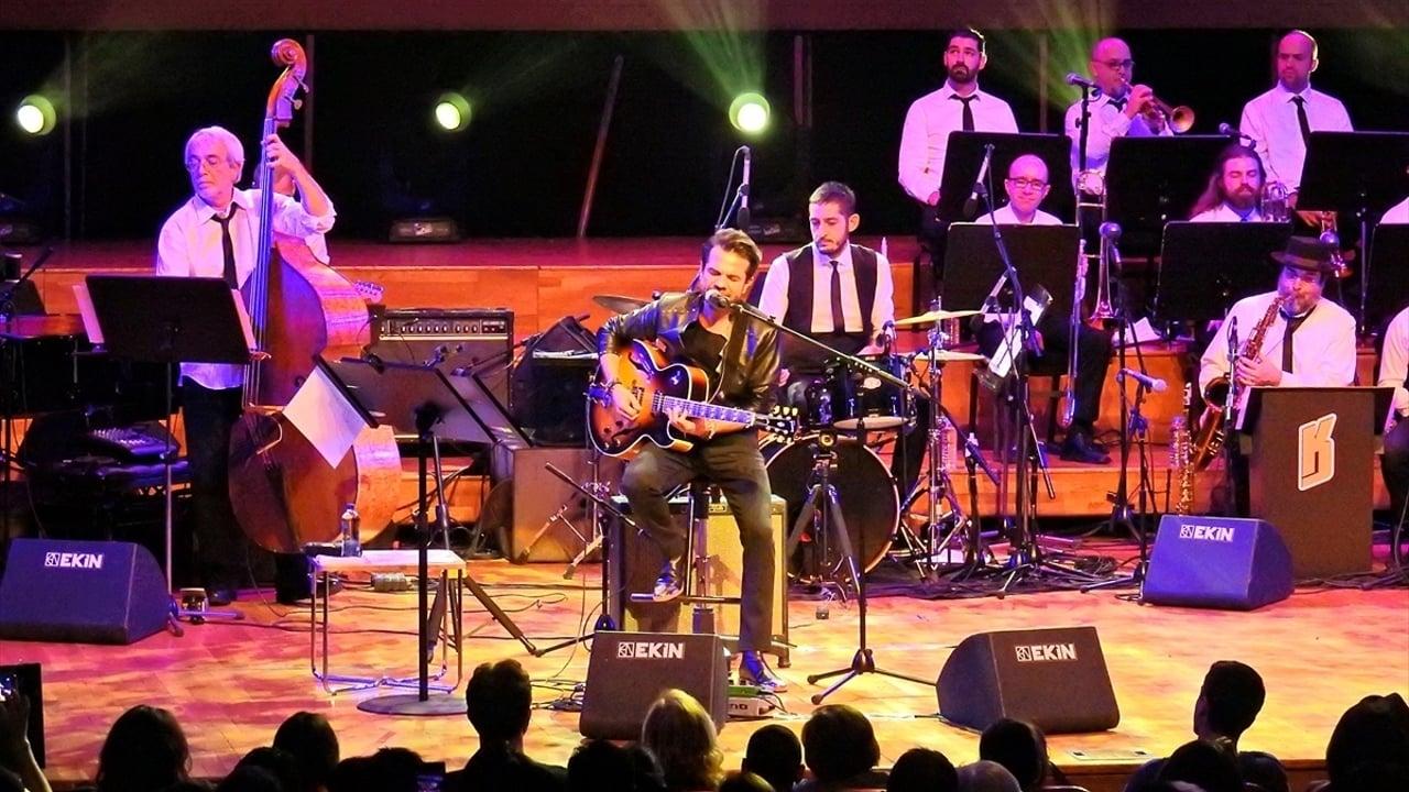 Kenan Dogulu Swings With Blue In Green Big Band backdrop