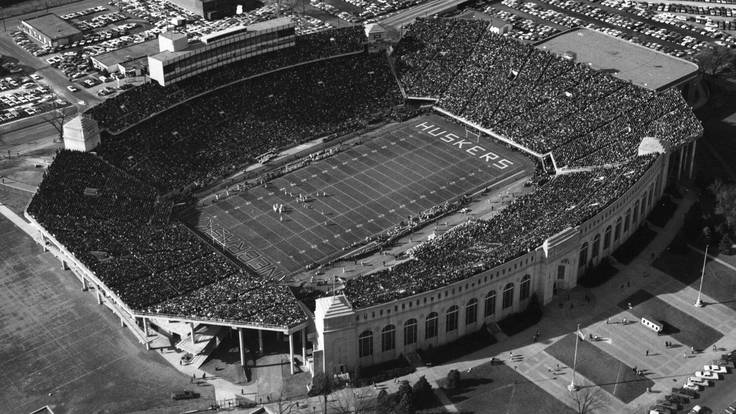 In the Deed the Glory: Memorial Stadium backdrop